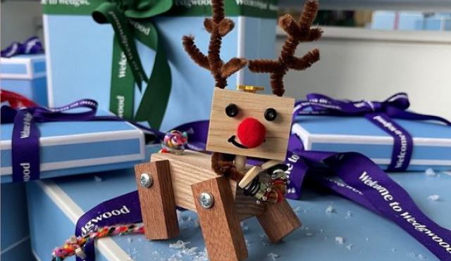 Wooden reindeer on wedgwood blue christmas presents